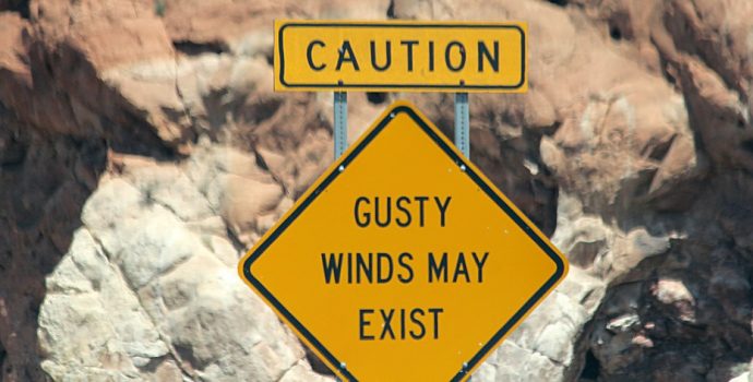 signpost saying gusty winds may exist